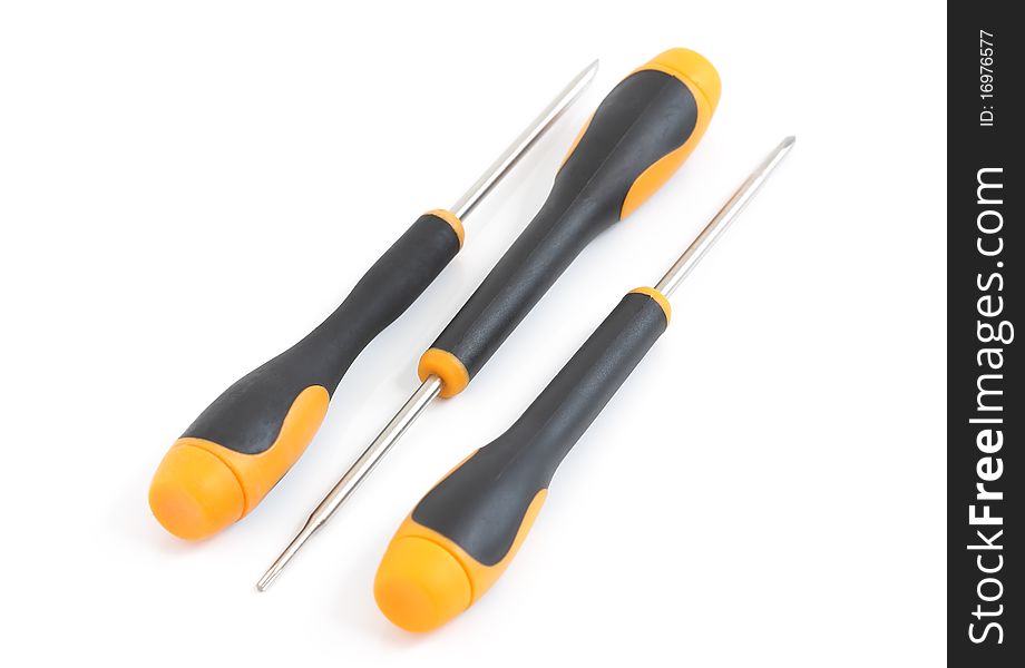 A set of three yellow and black screwdriver on a white background. A set of three yellow and black screwdriver on a white background