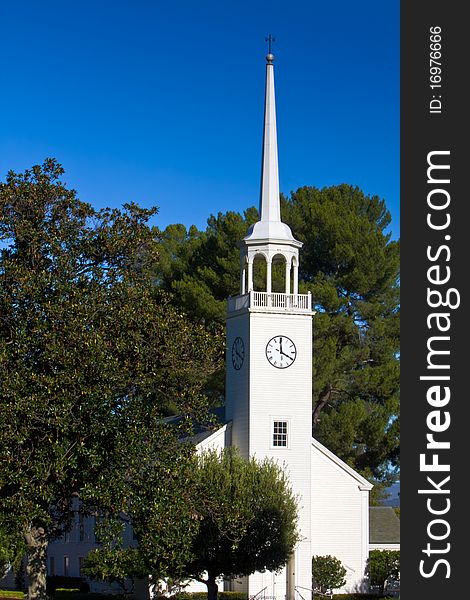 Small church with steeple in pastoral setting. Small church with steeple in pastoral setting.