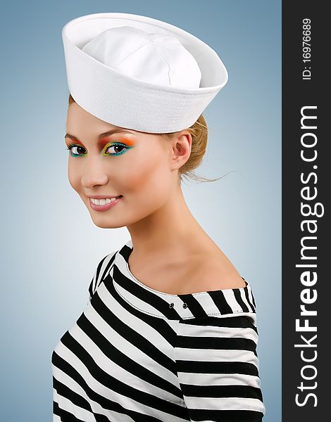 Attractive smiling young girl in sailor's cap. Attractive smiling young girl in sailor's cap