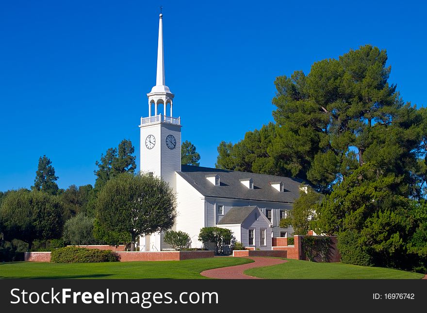 Small church with steeple in pastoral setting. Small church with steeple in pastoral setting.