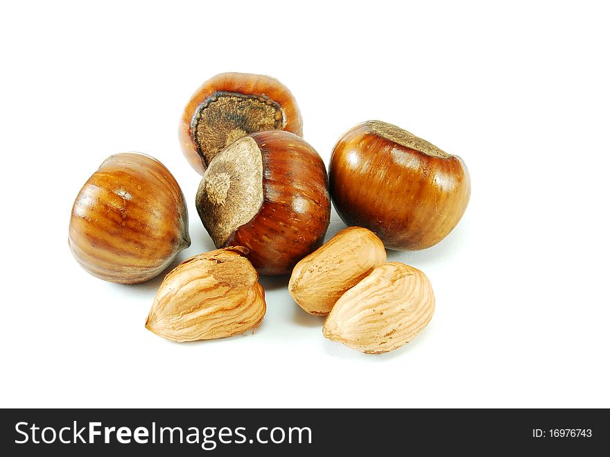 Brown hazelnuts isolated on white
