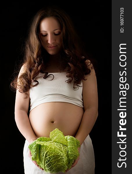 Pregnant woman with green cabbage. Pregnant woman with green cabbage