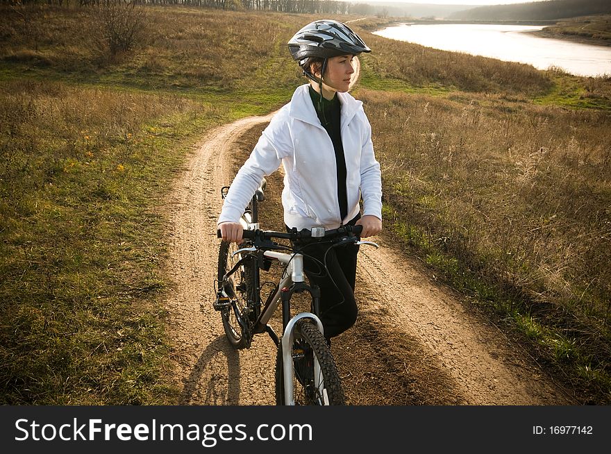 Girl relax biking in summer meadow. Girl relax biking in summer meadow