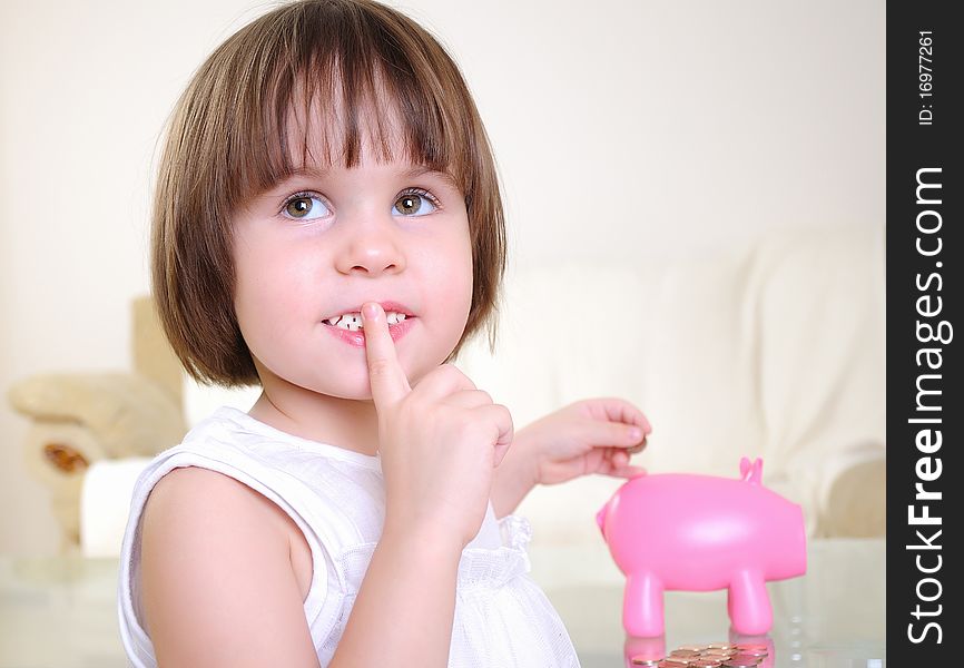 Little girl hides her money