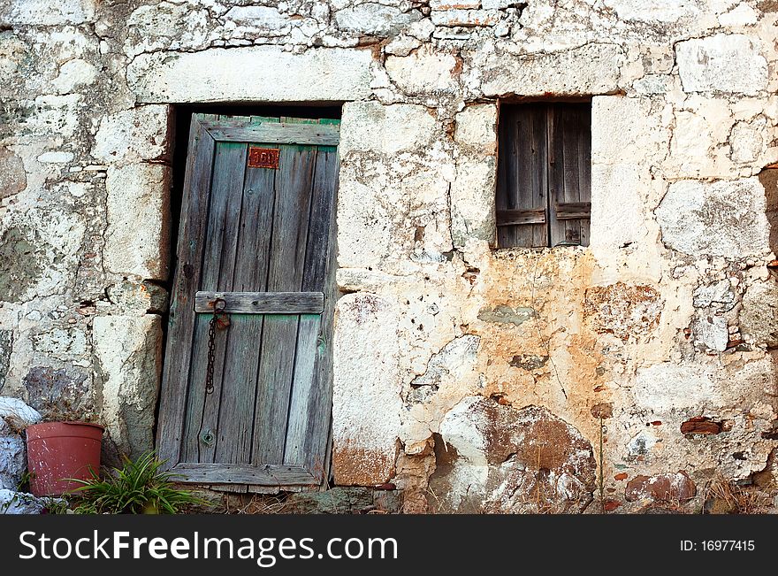 Old stone greek house entrance in a village