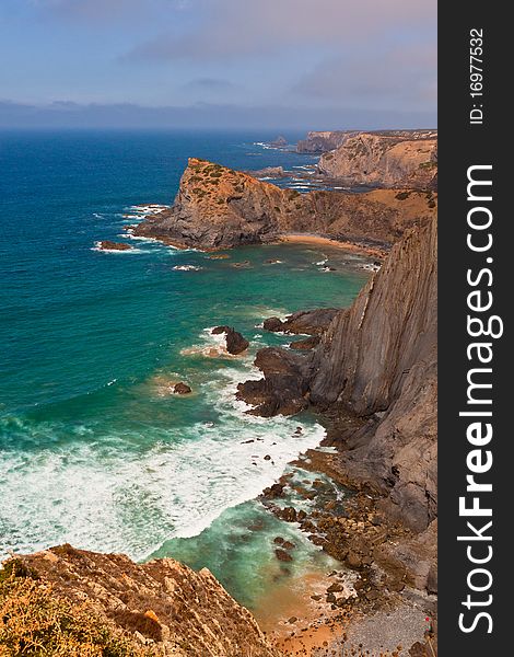 Beautiful rocky coast in Portugal, against the blue sky. Beautiful rocky coast in Portugal, against the blue sky.