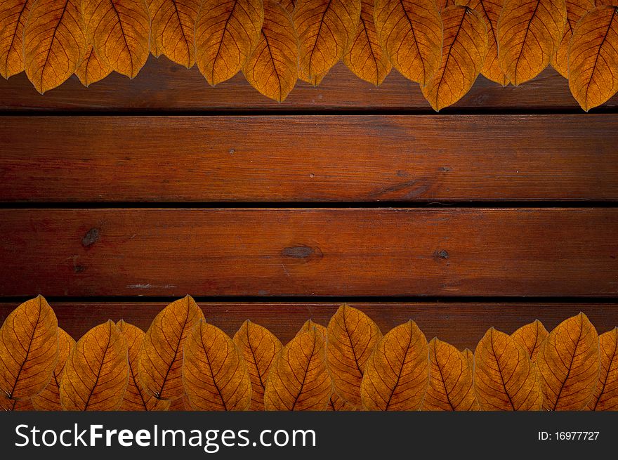 Brown Leafs On Wood Background