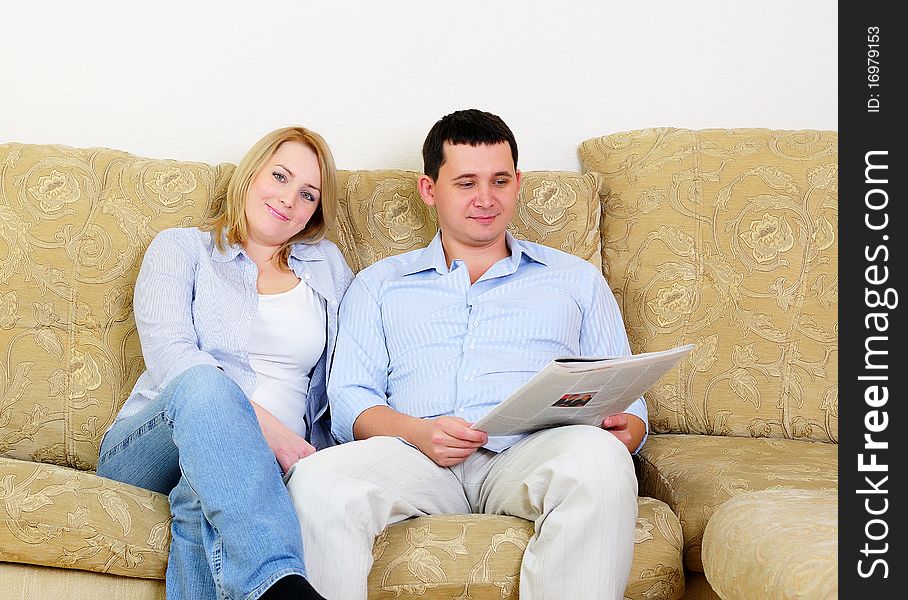 A young couple spends time together in the interior