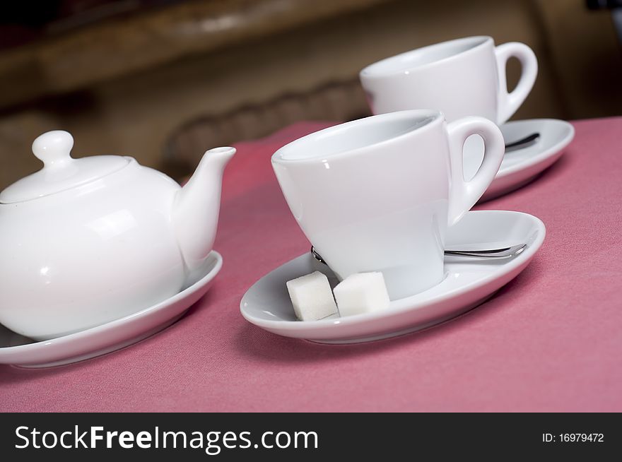 Serving teaspot with empty cup, sugar and teaspoon in the cafe. Serving teaspot with empty cup, sugar and teaspoon in the cafe