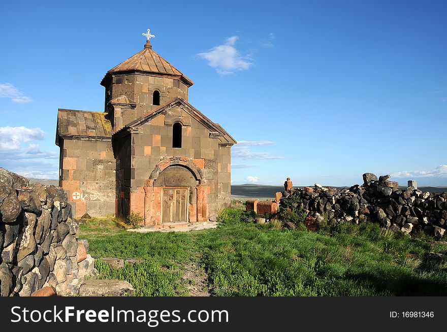 Old medieval church against blue sky background