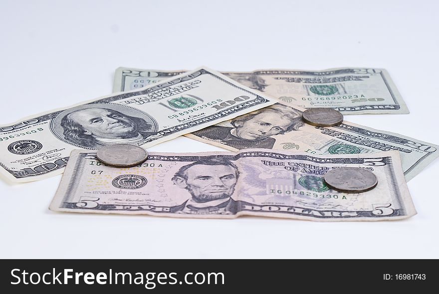 American banknotes and coins on white background. American banknotes and coins on white background