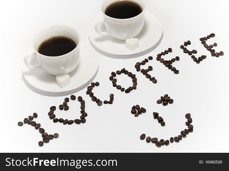 A rich cups of hot coffee, with white sugar on white background. A rich cups of hot coffee, with white sugar on white background