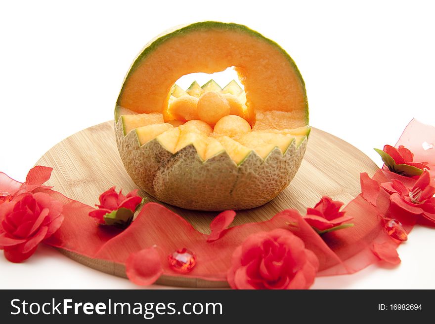 Refine melon with bow from roses