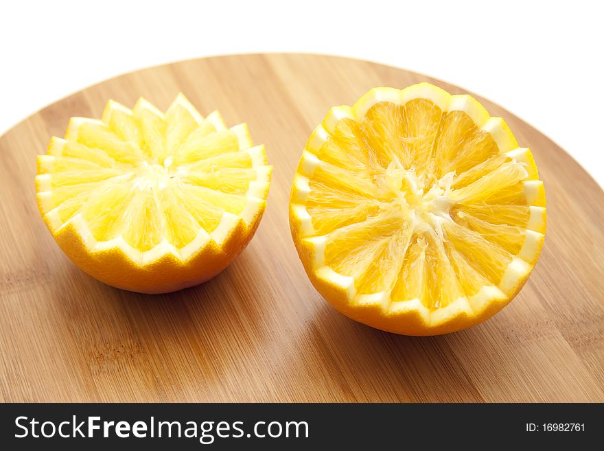Half orange with zickzack form on wood board