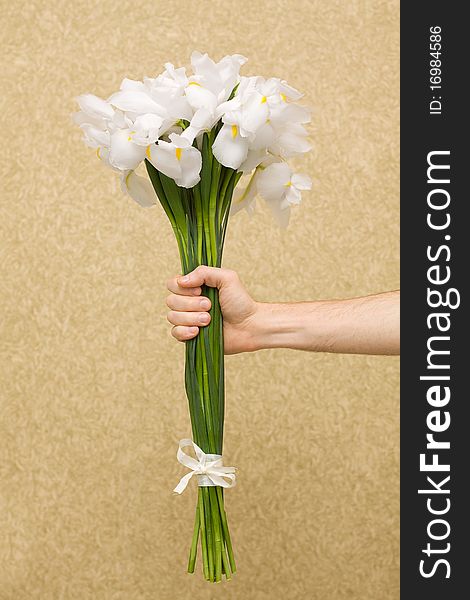 Man holding flowers on ornate background