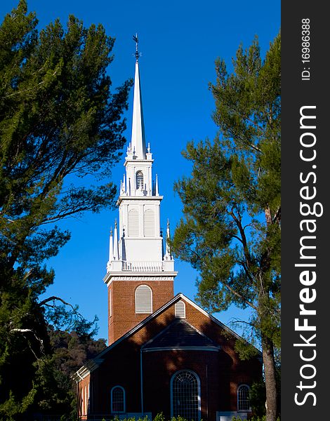 Small church with steeple in pastoral setting. Small church with steeple in pastoral setting.