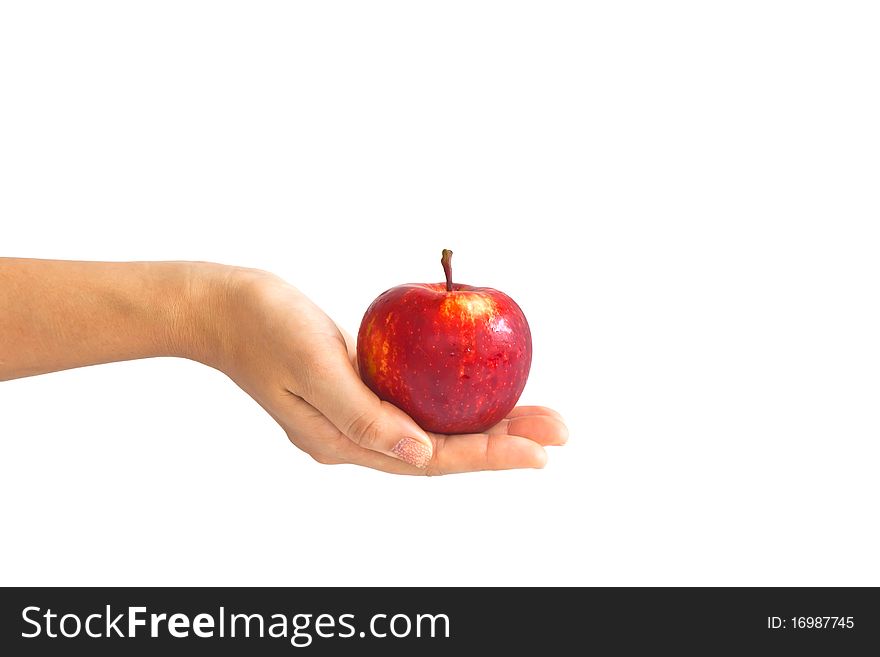 A young girl giving an apple to somebody