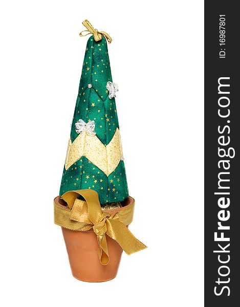 Artificial christmas green tree in brown pot with gold bow. Artificial christmas green tree in brown pot with gold bow