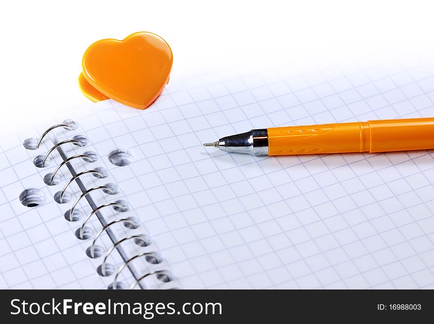 Blank note book with pen and Heart shaped clip. Blank note book with pen and Heart shaped clip