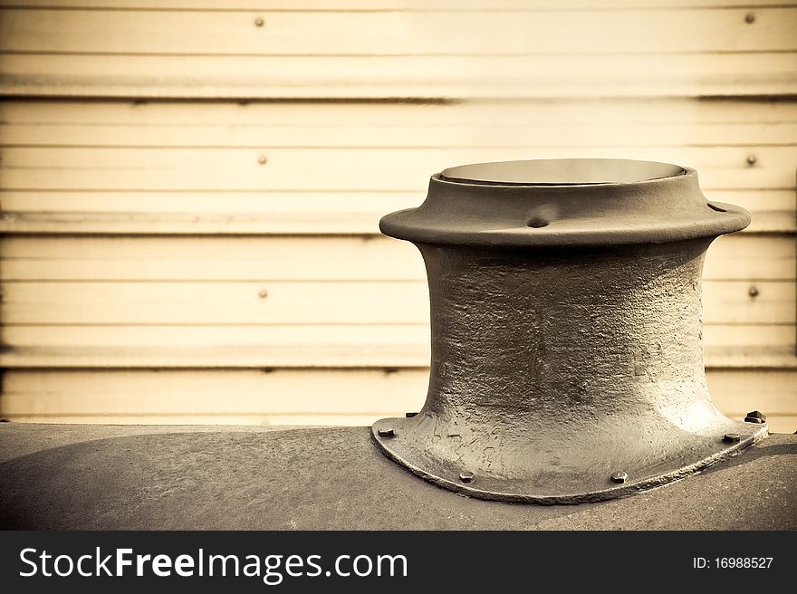 Steam escaping from the funnel of a vintage railroad engine