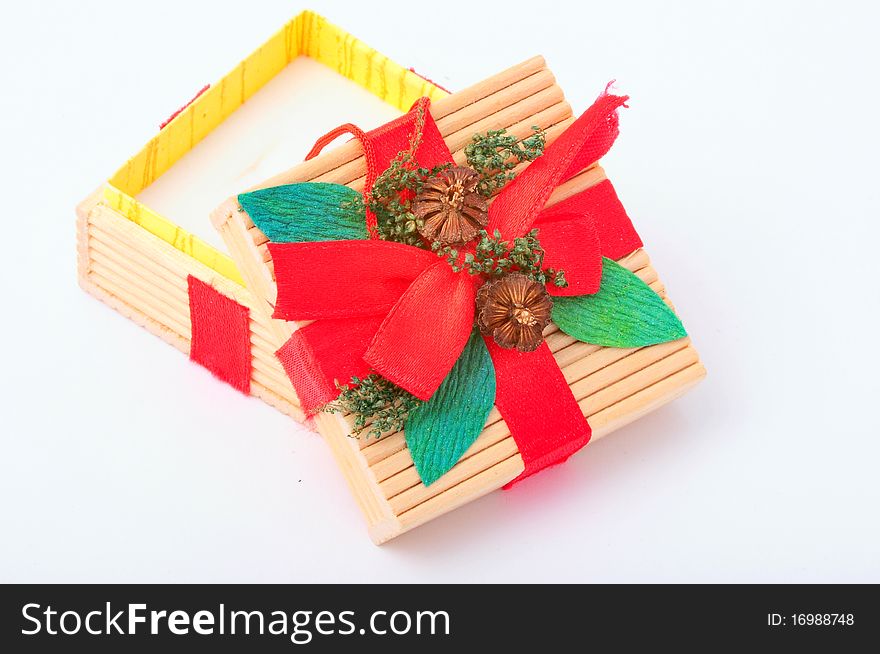 Wooden gift box with red ribbon