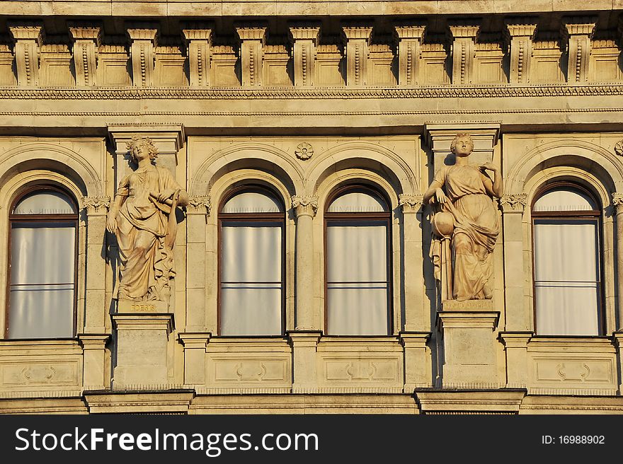 Windows with statues in the sunset