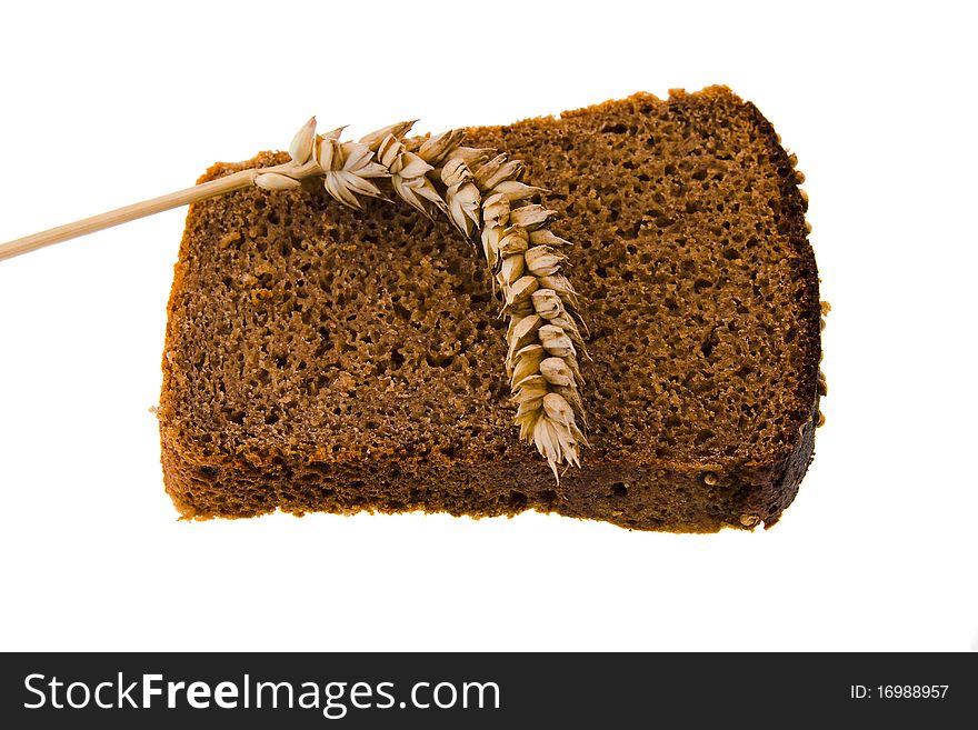 Bread slice on which wheat ear lies. Bread slice on which wheat ear lies
