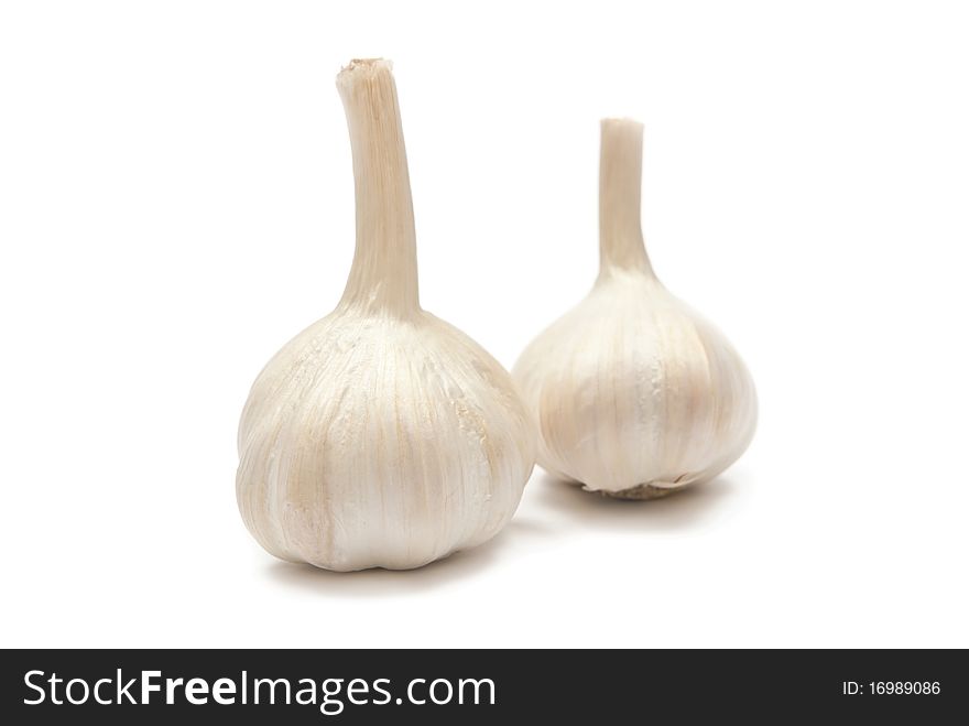 Close-up of two garlics isolated on white