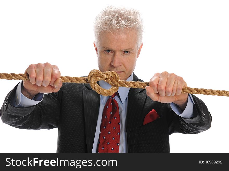 Businessman pulling a rope with knot isolated on a white background