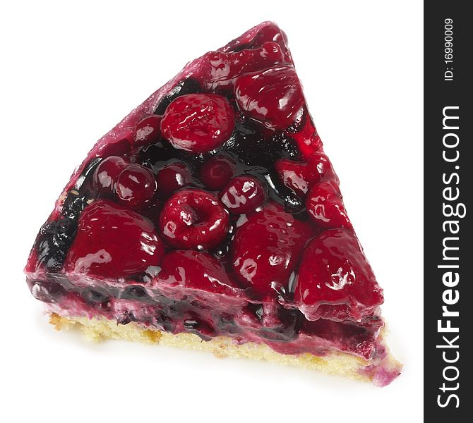 Small berries tart piece macro shot isolated over white background