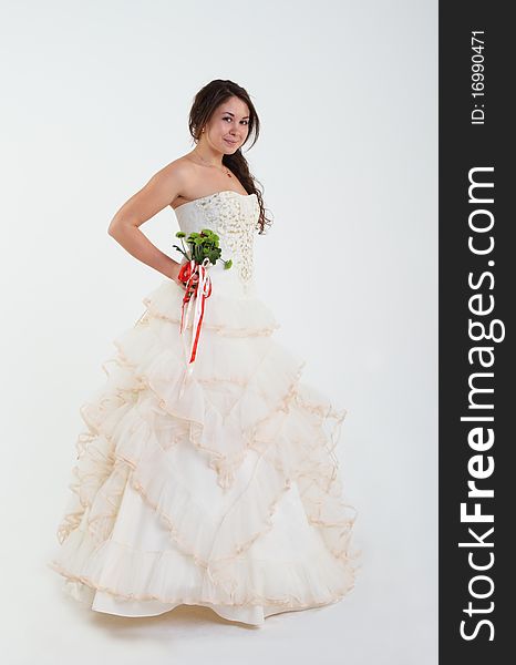 Smiling bride in wedding dress with bouquet. Smiling bride in wedding dress with bouquet
