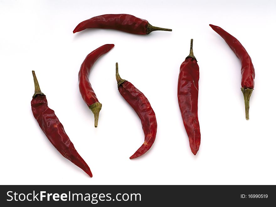 Six hot peppers on a white background