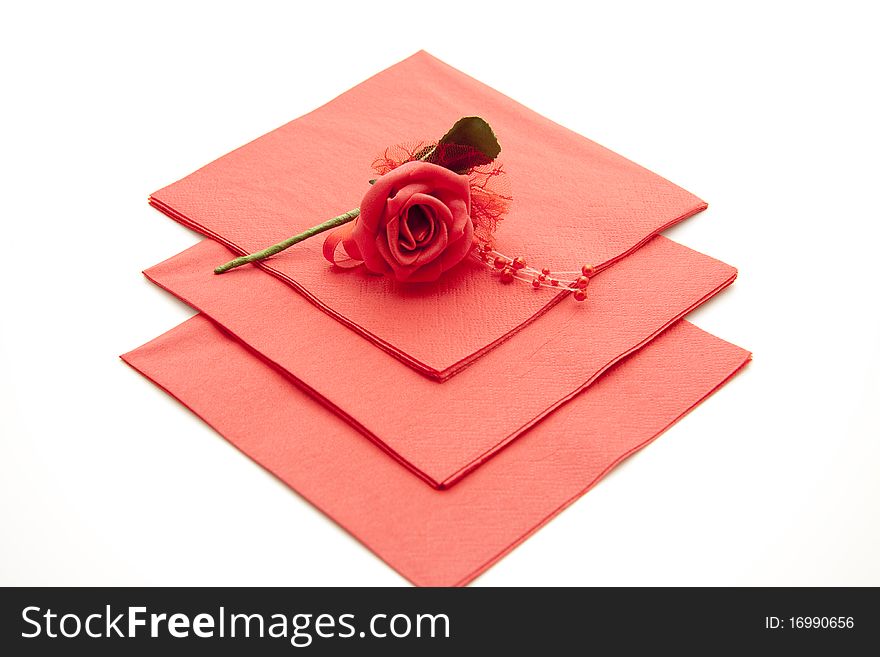 Red paper napkin with red rose. Red paper napkin with red rose