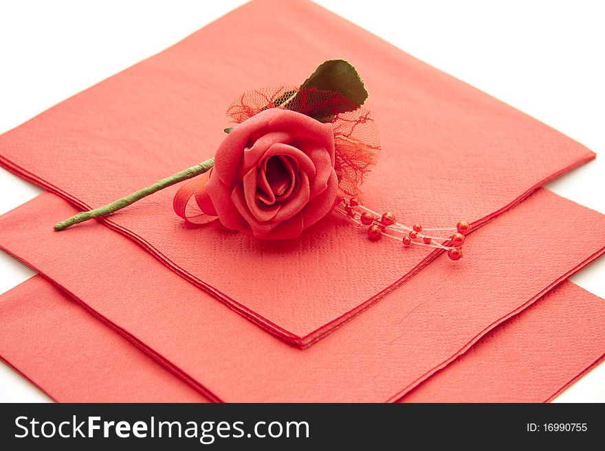 Red paper napkin with red rose