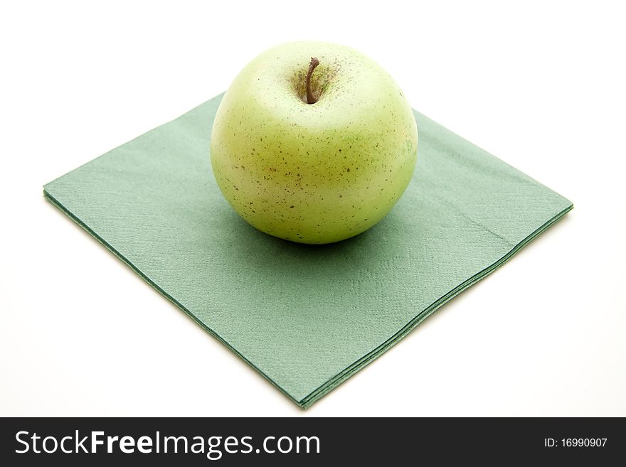 Green apple on green paper napkin. Green apple on green paper napkin