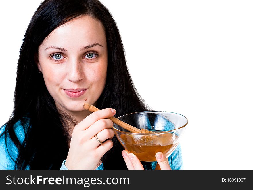 Girl holding honey bowl isolated