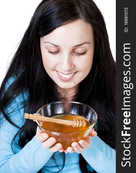 Girl holding honey bowl isolated