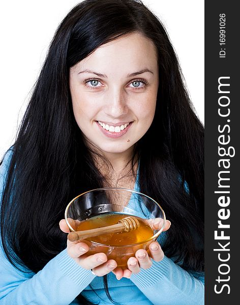 Girl holding honey bowl isolated