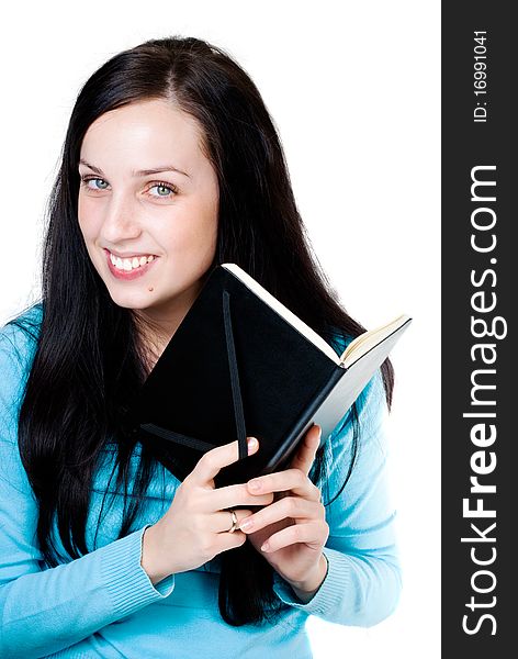 Smiling girl with a book isolated