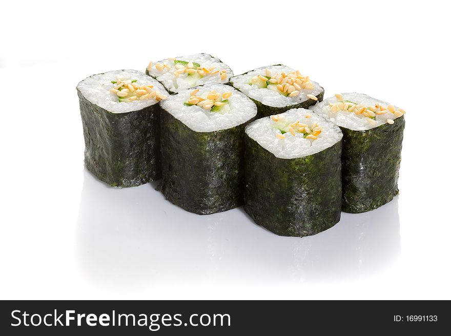 Cucumber maki with sesame topping on white ground