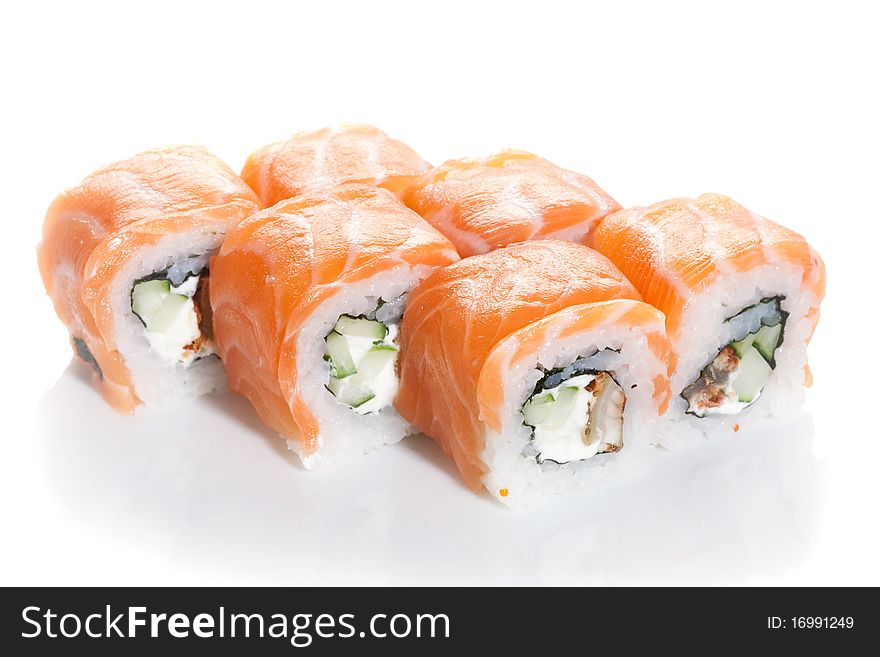 Sushi maki with salmon topping on white ground