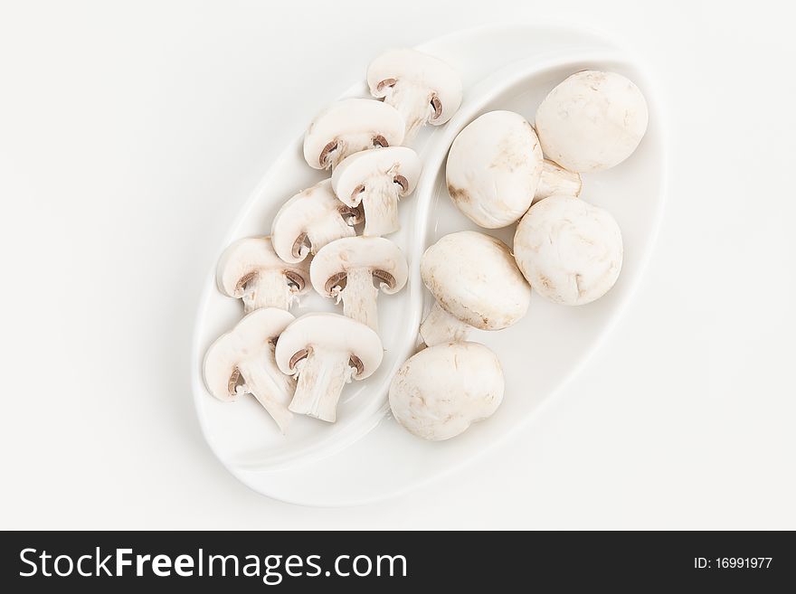 White plate with sliced mushrooms. White plate with sliced mushrooms