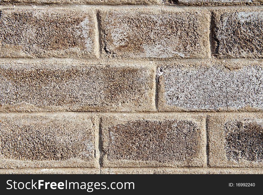 A detailed view of an old grey brick wall. A detailed view of an old grey brick wall.