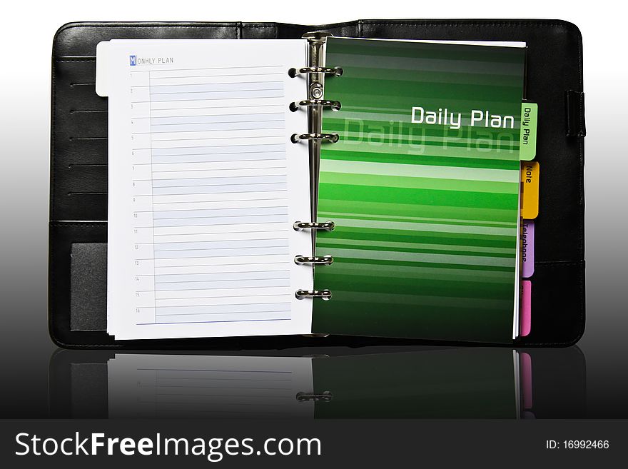 Notebook daily plan page with reflection