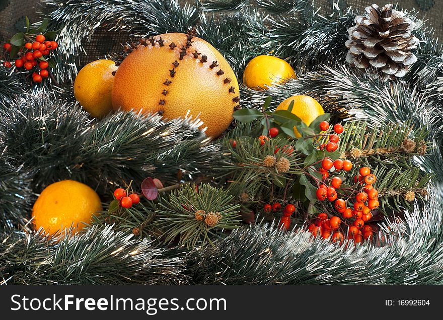 Christmas decoration with orange tangerines and tinsel. Christmas decoration with orange tangerines and tinsel