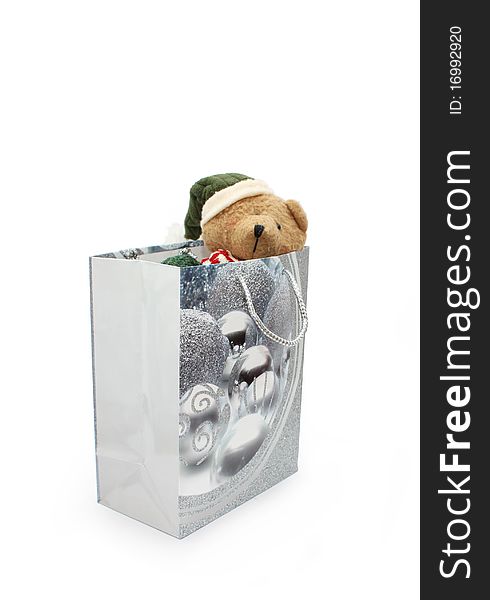 Teddy bear in a silver gift bag. Teddy bear in a silver gift bag