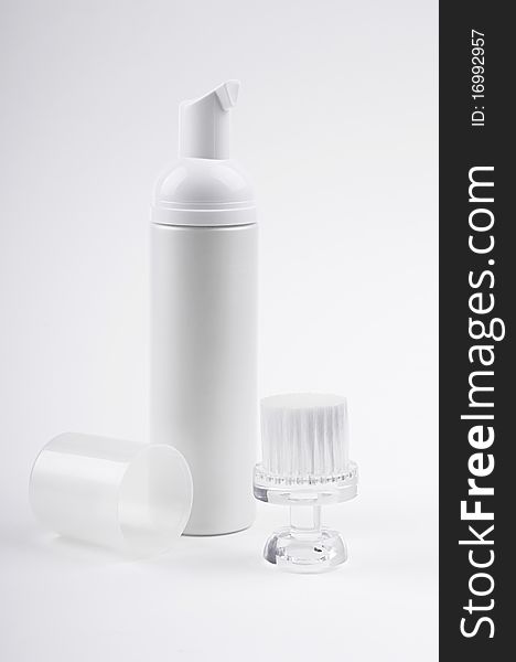 Cosmetic bottle and brush for face cleaning. Cosmetic bottle and brush for face cleaning.