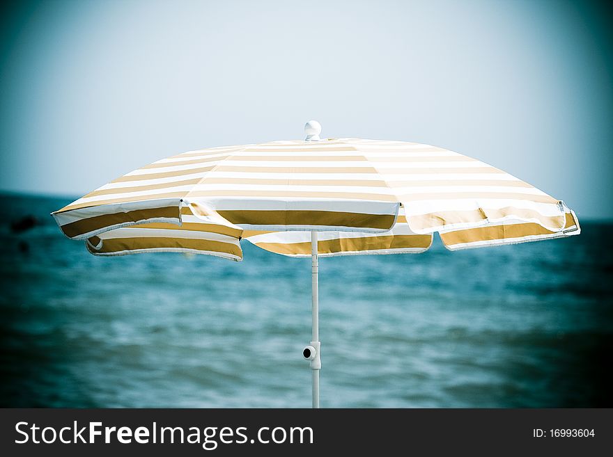 Colorful beach umbrella protecting of sun light