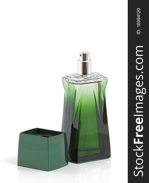 Green bottle of perfume on a white background