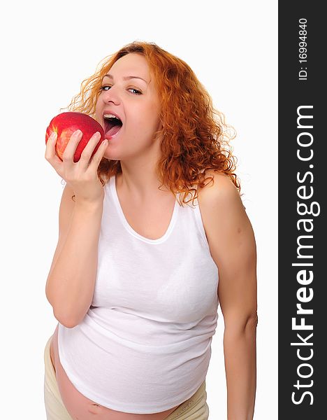 Young redhead pregnant mom thinks about healthy food